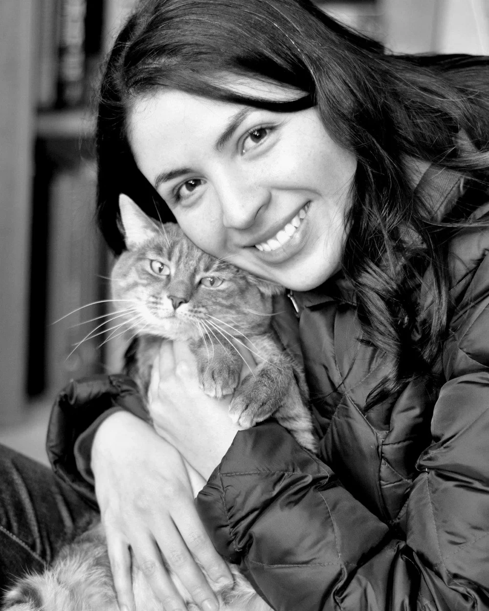 Mau Prada holding one of her cats